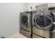 A well-equipped laundry room featuring modern, stainless steel front-loading washer and dryer at 2709 Eton St., Myrtle Beach, SC 29579