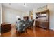 Cozy living room featuring hardwood floors, decorative chairs, and a wooden hutch for elegant storage at 2709 Eton St., Myrtle Beach, SC 29579