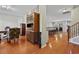 Open-concept living area featuring hardwood floors and an expansive view into the dining space at 2709 Eton St., Myrtle Beach, SC 29579