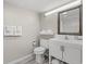 Clean bathroom featuring a white vanity with storage and fresh towels, offering a practical and refreshing space at 3000 N Ocean Blvd. # 420, Myrtle Beach, SC 29577