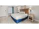 Comfortable bedroom with a large bed, wooden headboard, and soft lighting from bedside lamps at 3000 N Ocean Blvd. # 420, Myrtle Beach, SC 29577