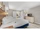 Comfortable bedroom, dresser and a glimpse into an adjacent kitchen, offering a peek at the suite layout at 3000 N Ocean Blvd. # 420, Myrtle Beach, SC 29577