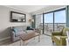 Bright living room featuring a sofa, accent chair, and ocean view balcony at 3000 N Ocean Blvd. # 420, Myrtle Beach, SC 29577