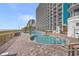 Large outdoor pool with ample lounge seating and an ocean view at this resort at 3000 N Ocean Blvd. # 420, Myrtle Beach, SC 29577