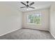 Bedroom featuring neutral walls, gray carpet, a window for natural light, and a ceiling fan at 3017 Mercer Dr. # 0, Conway, SC 29526