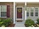Inviting front door with decorative wreath, stylish brick accents, and well-kept landscaping at 3017 Mercer Dr. # 0, Conway, SC 29526
