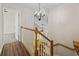 Hallway with chandelier and wood floors leading to bedrooms at 3017 Mercer Dr. # 0, Conway, SC 29526