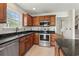 Well-lit kitchen featuring stainless steel appliances, granite countertops, and ample cabinet space at 3017 Mercer Dr. # 0, Conway, SC 29526