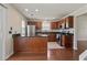 Bright eat-in kitchen with stainless steel appliances, dark countertops, and wood flooring at 3017 Mercer Dr. # 0, Conway, SC 29526