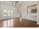 Spacious living room with hardwood floors and staircase at 3017 Mercer Dr. # 0, Conway, SC 29526