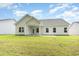 Spacious backyard with a covered patio and well-maintained lawn perfect for outdoor activities at 3308 Little Bay Dr., Conway, SC 29526
