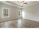 Bright bedroom featuring two windows with natural light and hardwood flooring at 3308 Little Bay Dr., Conway, SC 29526