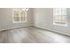 Dining room with large windows, contemporary flooring, and a modern chandelier at 3308 Little Bay Dr., Conway, SC 29526