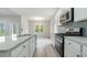 Modern kitchen featuring a large island, granite countertops, and stainless steel appliances at 3308 Little Bay Dr., Conway, SC 29526
