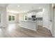 Bright kitchen featuring white cabinetry, a center island, and stainless steel appliances at 3308 Little Bay Dr., Conway, SC 29526