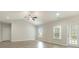 Spacious living area featuring vaulted ceilings, ceiling fan, and access to outdoor patio at 3308 Little Bay Dr., Conway, SC 29526