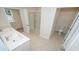 The bathroom has double sinks, a tiled floor, and a walk-in shower at 3557 Ashridge Way, Conway, SC 29526