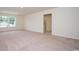 A spacious carpeted bedroom with natural light and a walk-in closet at 3557 Ashridge Way, Conway, SC 29526