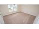 Bedroom with window and neutral carpet and walls at 3557 Ashridge Way, Conway, SC 29526