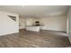 A well-lit open floor plan features modern flooring and access to the kitchen at 3557 Ashridge Way, Conway, SC 29526