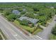 An aerial view shows a well-maintained home with a lush lawn and mature trees at 3907 N Ocean Blvd., Myrtle Beach, SC 29572