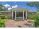 Back of house showing brick patio, hot tub, pillars and landscaping at 3907 N Ocean Blvd., Myrtle Beach, SC 29572