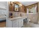 Bathroom with a vanity, decorative wallpaper, and a window with valance at 3907 N Ocean Blvd., Myrtle Beach, SC 29572