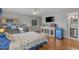 Bedroom with TV and desk, wood floors and seashell-themed bedding at 3907 N Ocean Blvd., Myrtle Beach, SC 29572