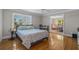 Sunlit bedroom with hardwood floors, desk, and a connecting sitting room at 3907 N Ocean Blvd., Myrtle Beach, SC 29572