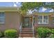Inviting front entry with brick steps, railing, and well-maintained landscaping at 3907 N Ocean Blvd., Myrtle Beach, SC 29572
