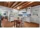 Charming kitchen with wood ceiling, white cabinets, tile backsplash and a breakfast nook at 3907 N Ocean Blvd., Myrtle Beach, SC 29572