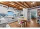 Charming kitchen with wood ceiling, white cabinets, tile backsplash and a breakfast nook at 3907 N Ocean Blvd., Myrtle Beach, SC 29572