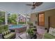 Covered patio with a hot tub, ceiling fan, and comfortable seating at 3907 N Ocean Blvd., Myrtle Beach, SC 29572