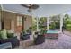 Covered patio with a hot tub, ceiling fan, and comfortable seating at 3907 N Ocean Blvd., Myrtle Beach, SC 29572
