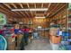 Unfinished storage space with exposed wood beams, concrete floor, and a window offering natural light at 3907 N Ocean Blvd., Myrtle Beach, SC 29572