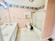The bathroom features a double sink vanity, a toilet, and a shower/tub with a sliding glass door at 3978 Tybre Downs Circle # 3978, Little River, SC 29566