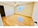 A bedroom featuring wood flooring, a ceiling fan, and a single window at 3978 Tybre Downs Circle # 3978, Little River, SC 29566