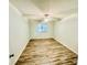 A bedroom featuring laminate wood flooring and a single window at 3978 Tybre Downs Circle # 3978, Little River, SC 29566