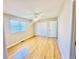 Bright bedroom with hardwood floors, a ceiling fan, closet space, and a window with blinds at 3978 Tybre Downs Circle # 3978, Little River, SC 29566