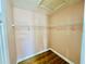 Small closet with wood floors and one wire shelf for extra storage space at 3978 Tybre Downs Circle # 3978, Little River, SC 29566