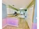 Bright kitchen featuring white cabinetry, tile floors, and modern appliances at 3978 Tybre Downs Circle # 3978, Little River, SC 29566