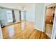 Spacious main bedroom with hardwood floors, many windows, and an ensuite bathroom at 3978 Tybre Downs Circle # 3978, Little River, SC 29566
