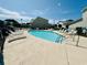Community pool with sparkling water, lounge chairs, and clearly marked depth and safety signage at 3978 Tybre Downs Circle # 3978, Little River, SC 29566