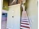 A view of a stairway with brown wood treads and white risers at 3978 Tybre Downs Circle # 3978, Little River, SC 29566
