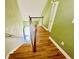 A view of a stairway with brown wood treads and painted white walls at 3978 Tybre Downs Circle # 3978, Little River, SC 29566