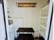 This is a storage room with hooks, a table, and a water heater at 3978 Tybre Downs Circle # 3978, Little River, SC 29566