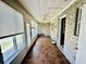 Sunroom featuring tiled flooring, a ceiling fan, multiple windows, and a doorway to the outside at 3978 Tybre Downs Circle # 3978, Little River, SC 29566