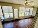 Enclosed sunroom featuring windows, a ceiling fan, and tile flooring, creating a bright and inviting space at 3978 Tybre Downs Circle # 3978, Little River, SC 29566