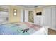 Comfortable bedroom with a bed, neutral carpet, and easy access to the attached bathroom and hallway at 421 30Th Ave. S, Sunset Beach, NC 28468