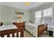 Bedroom featuring 2 twin beds, a light colored wall, and a window with natural light at 421 30Th Ave. S, Sunset Beach, NC 28468